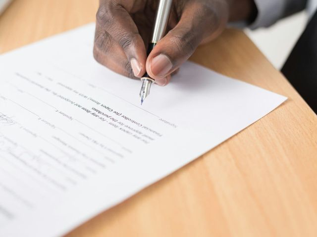 Signing contract fountain pen Hand signing a contract with a fountain pen